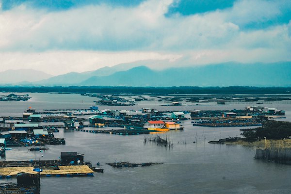 Flooded houses under a grey, overcast sky