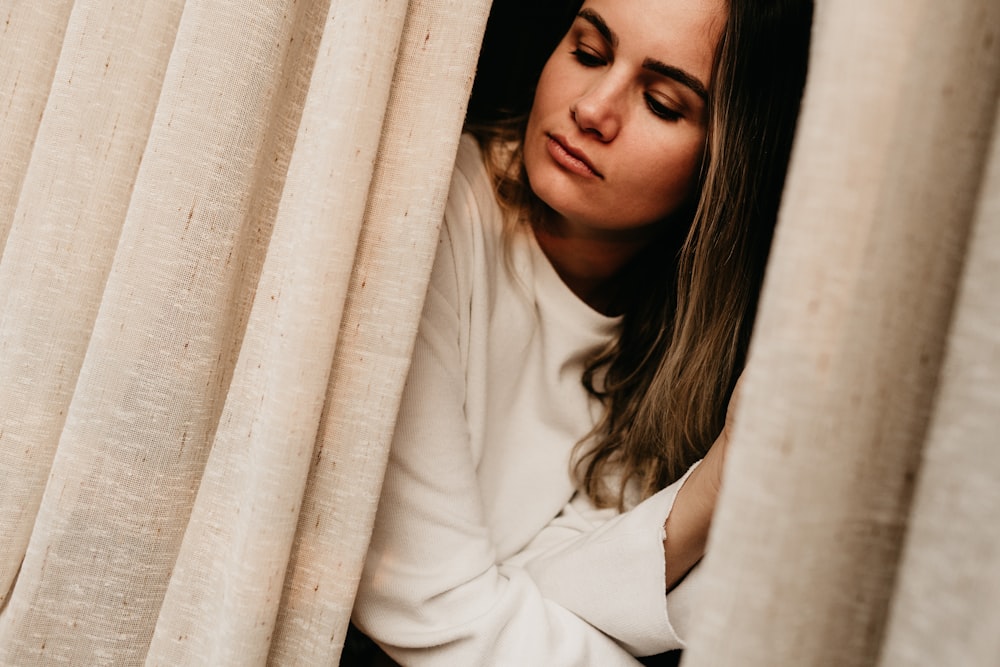 woman sitting near window