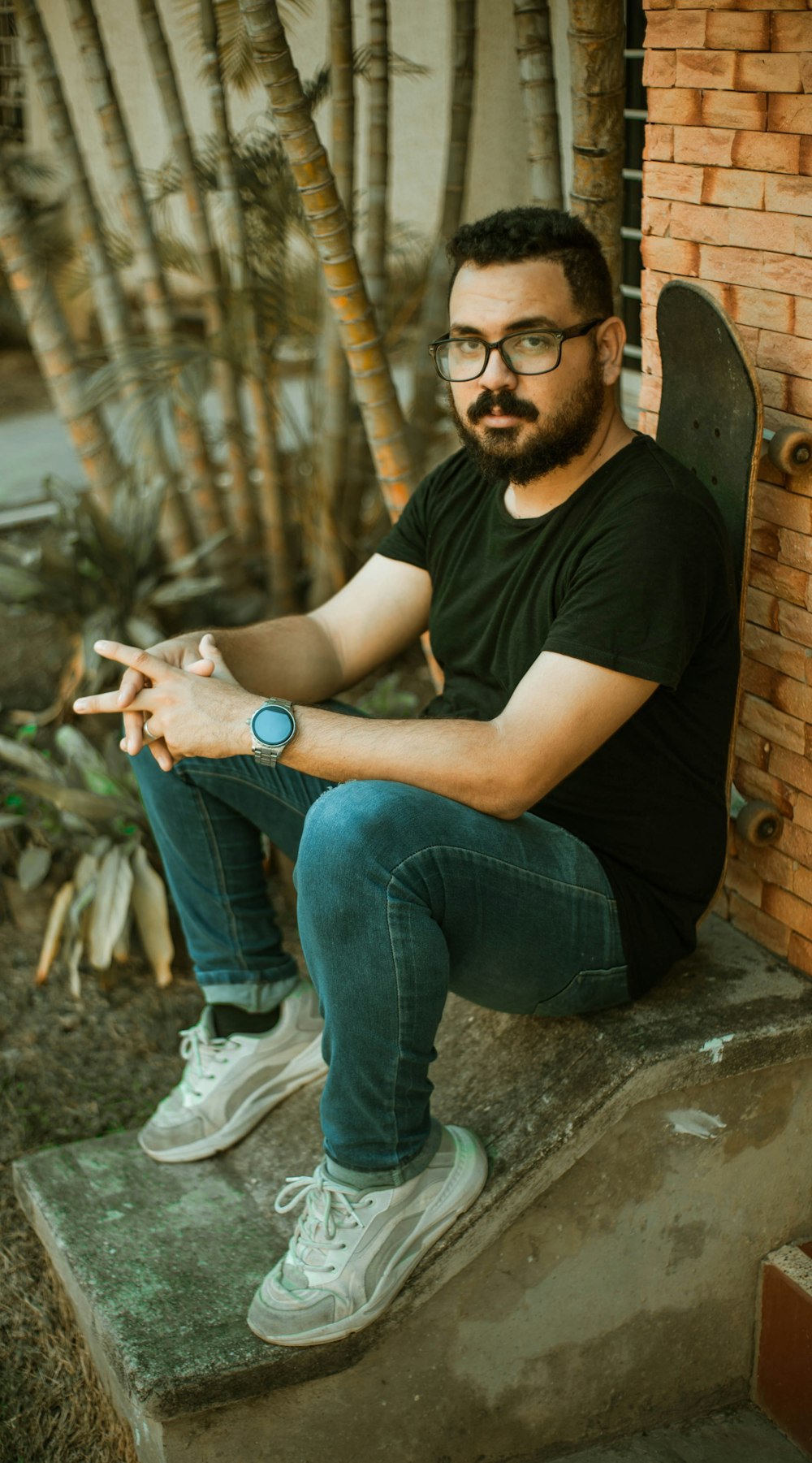 man sits near wall