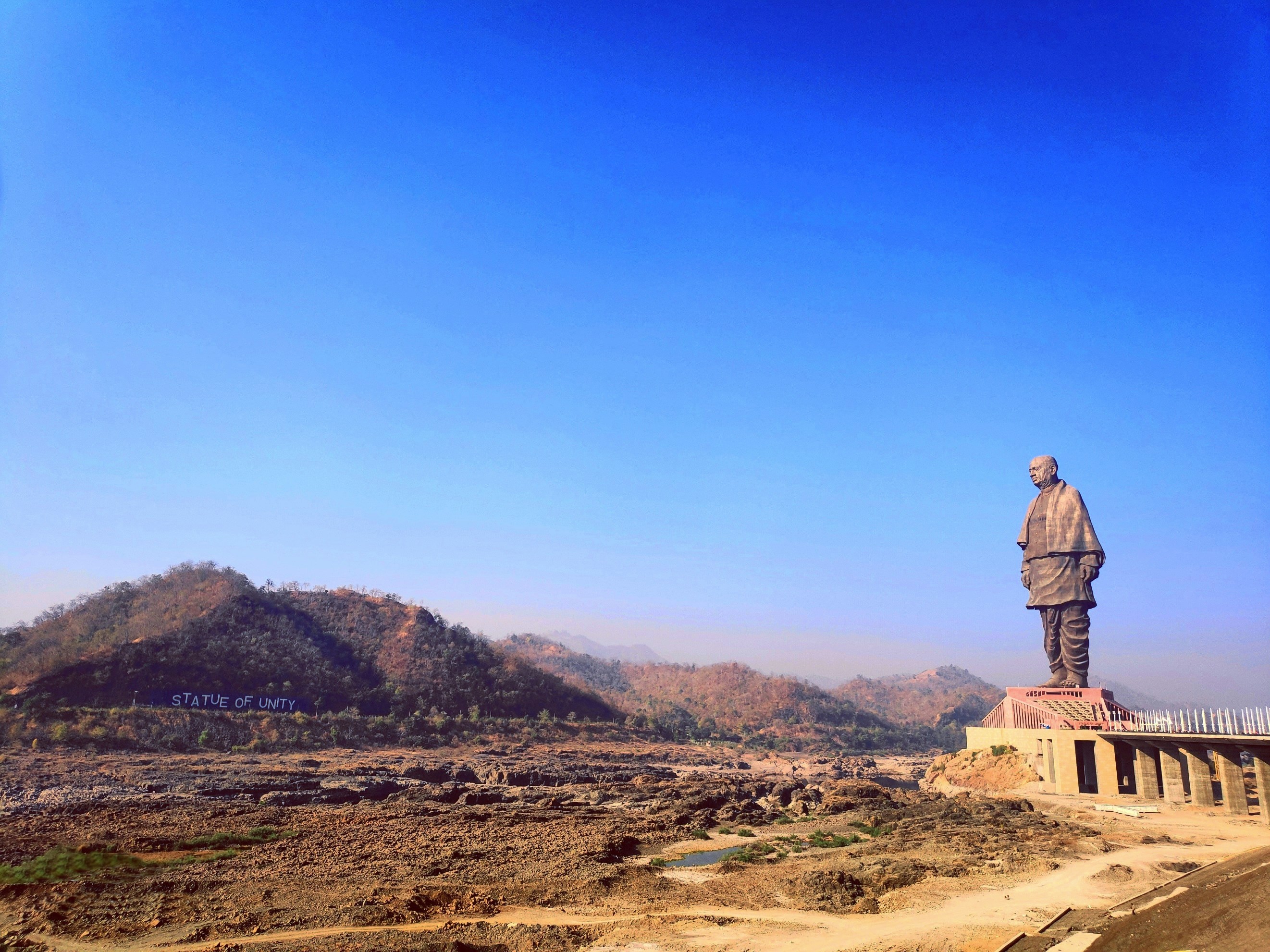 Statue of Unity monument against blue sky