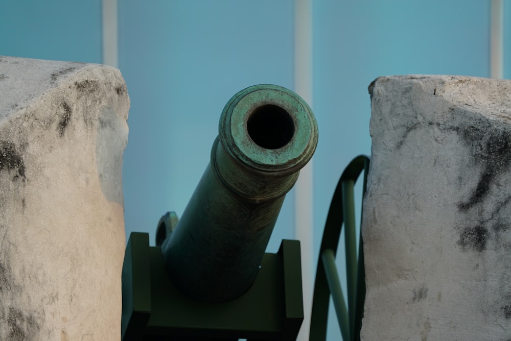 selective focus photography of a green cannon