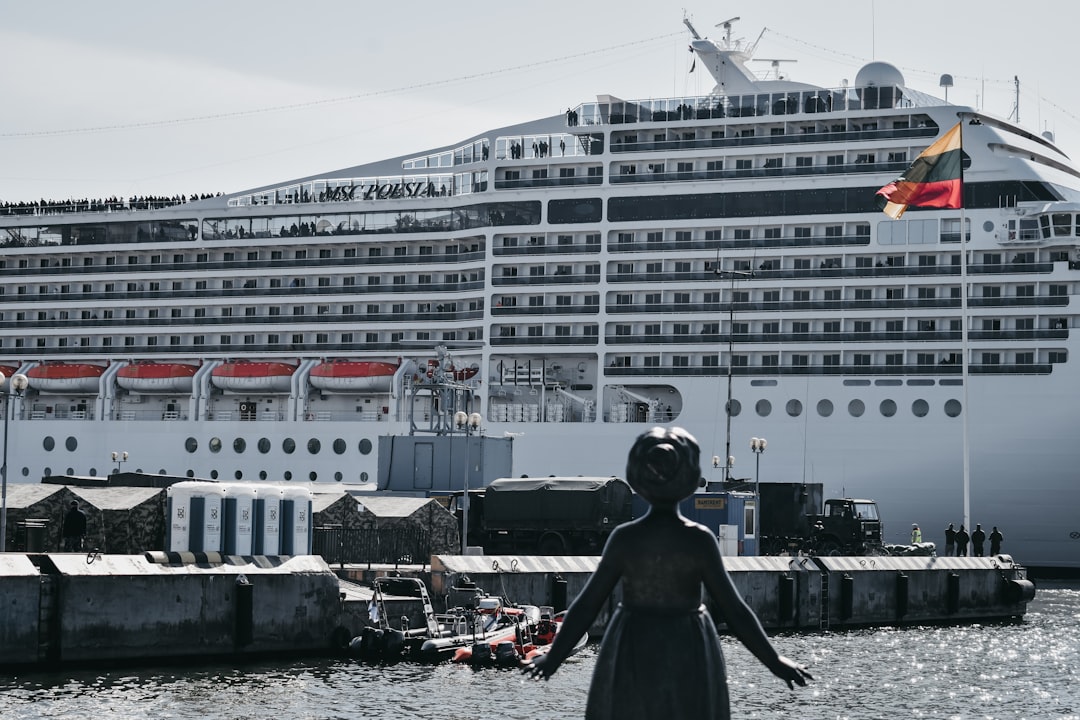 girl standing front of ship