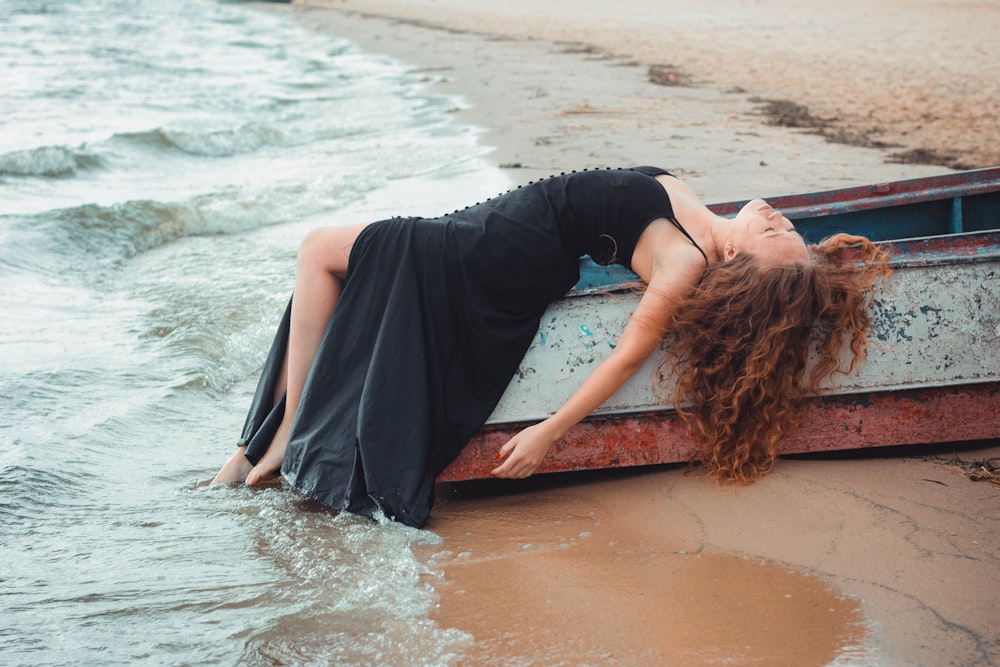 woman leaning on boat