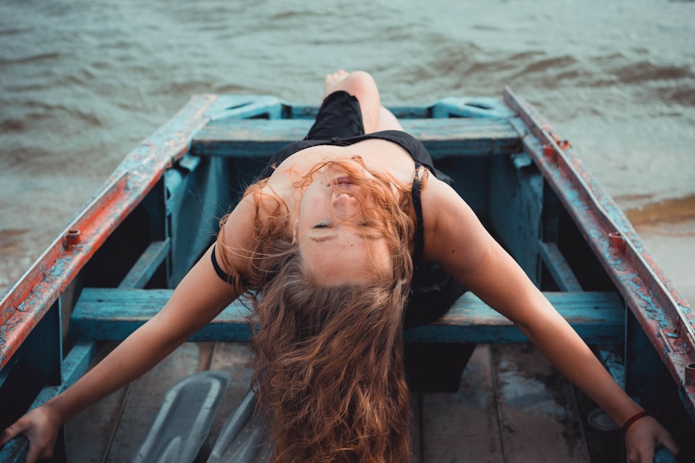 woman riding on jon boat