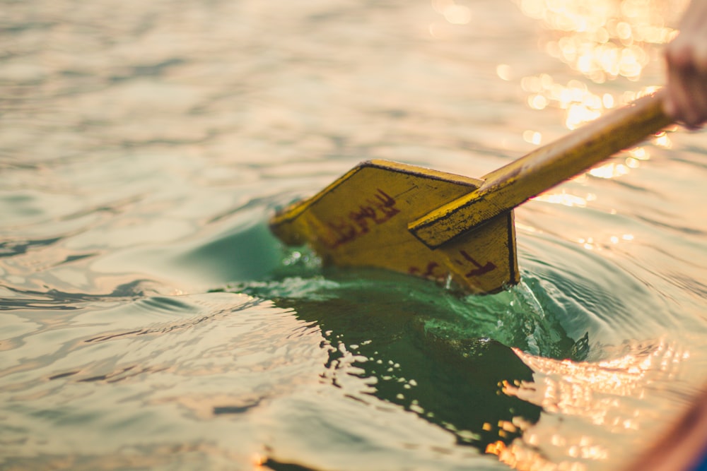 yellow boat paddle