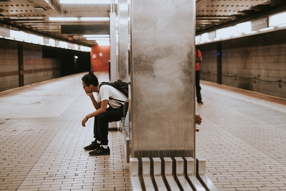 sitting man on metal chair