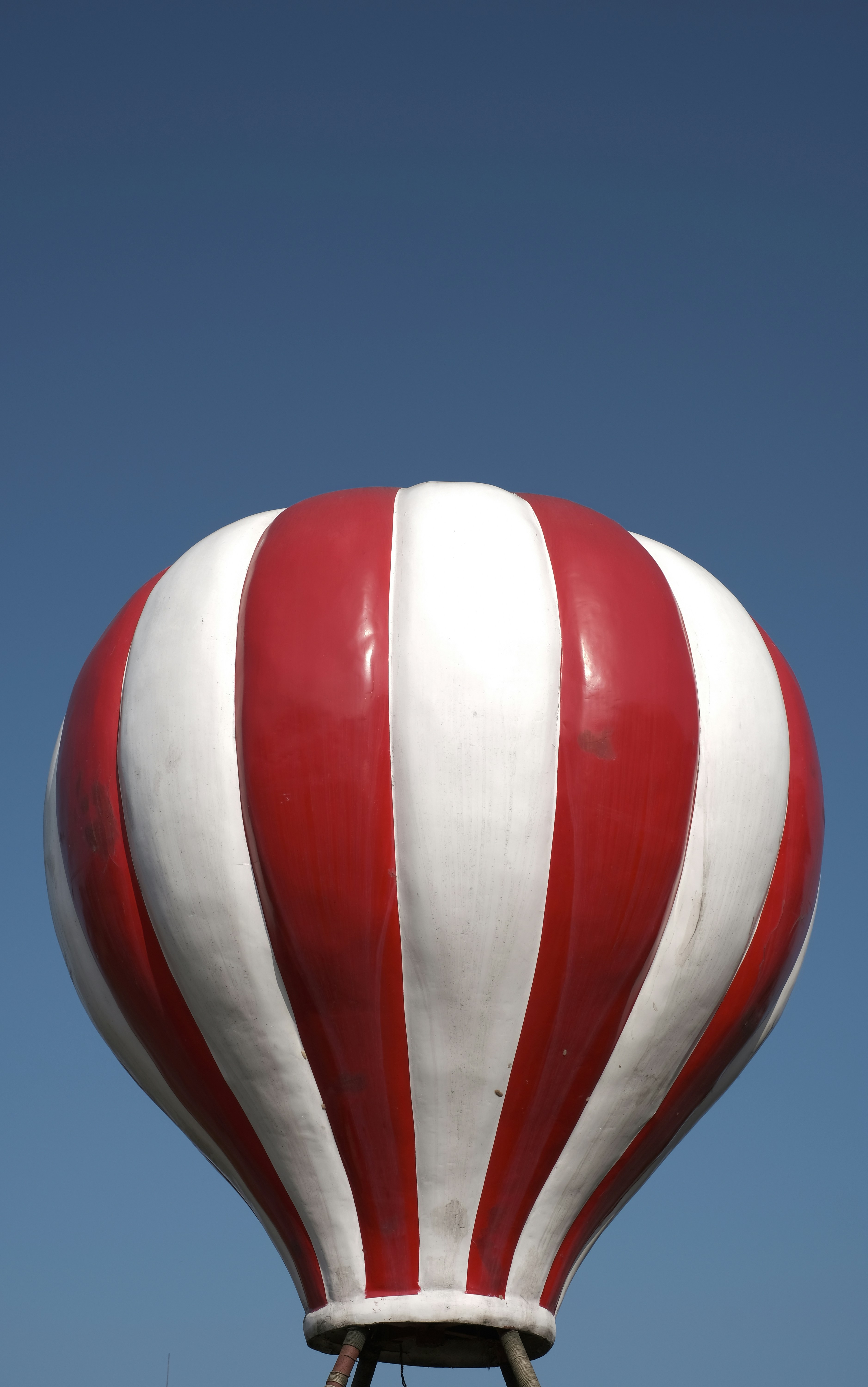 a large red and white striped hot air balloon