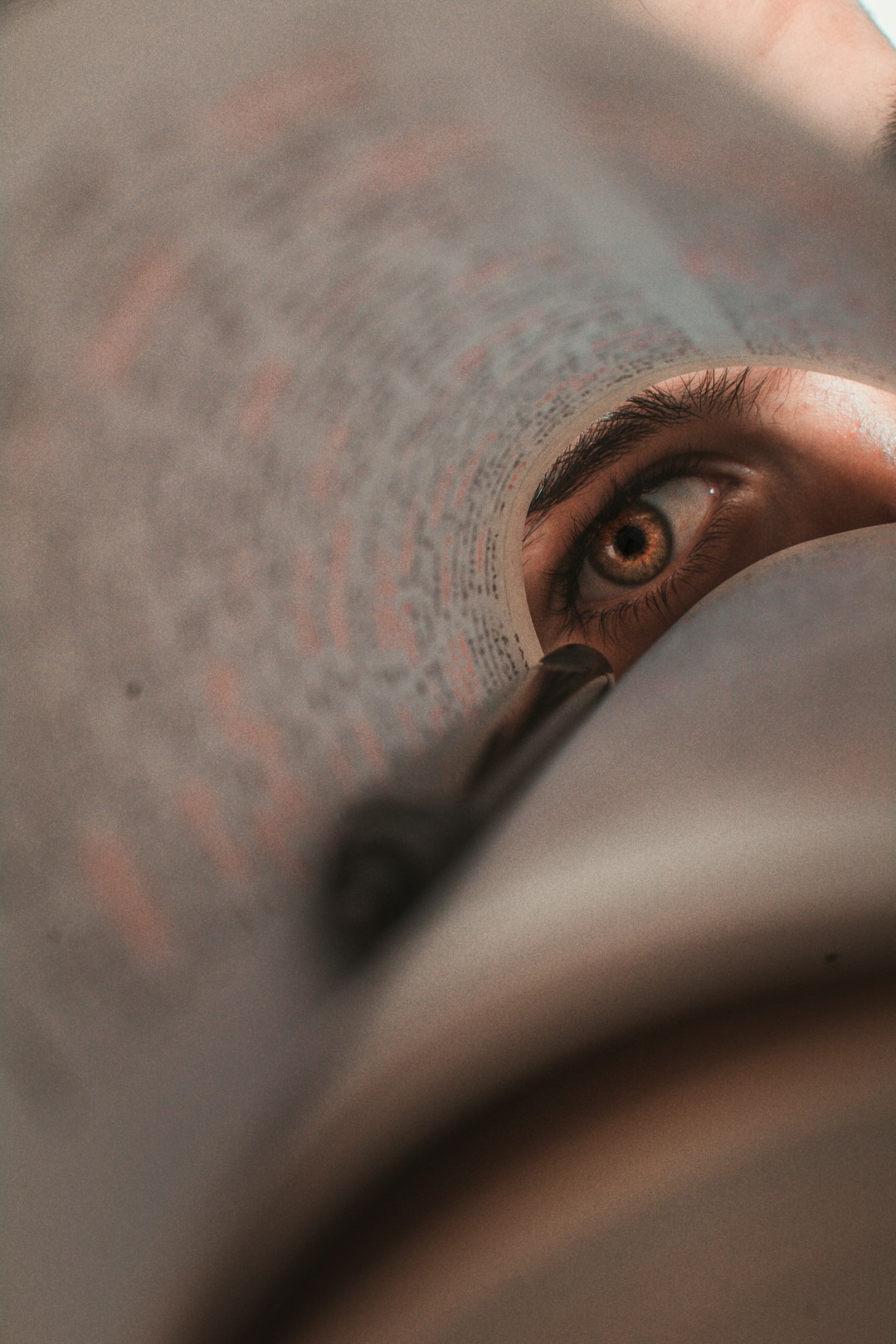 human eye behind book page
