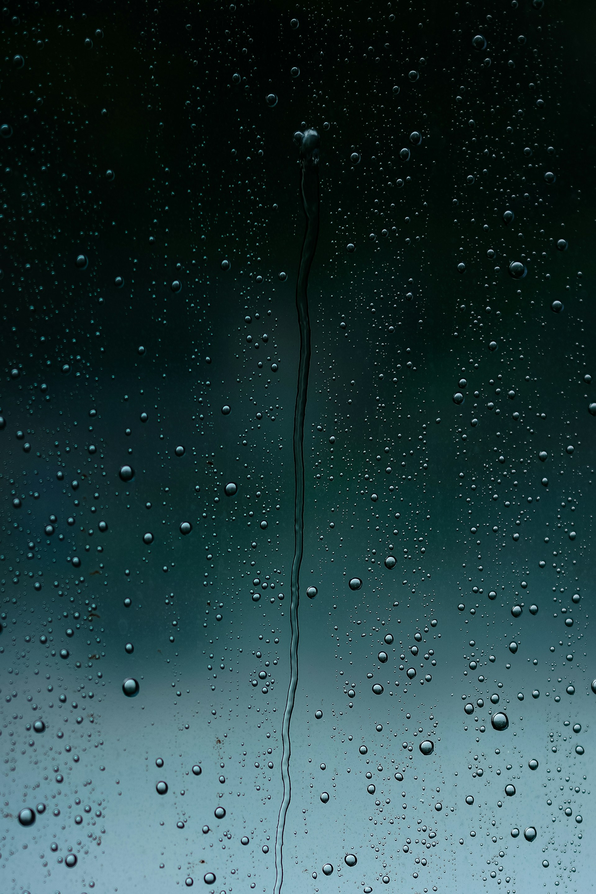 a close up of a window with drops of water