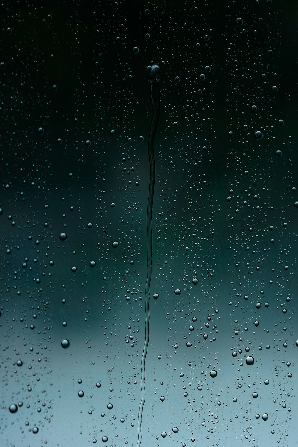 a close up of a window with drops of water