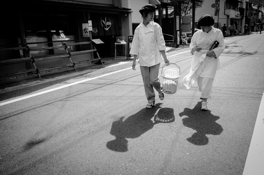two women walking on street