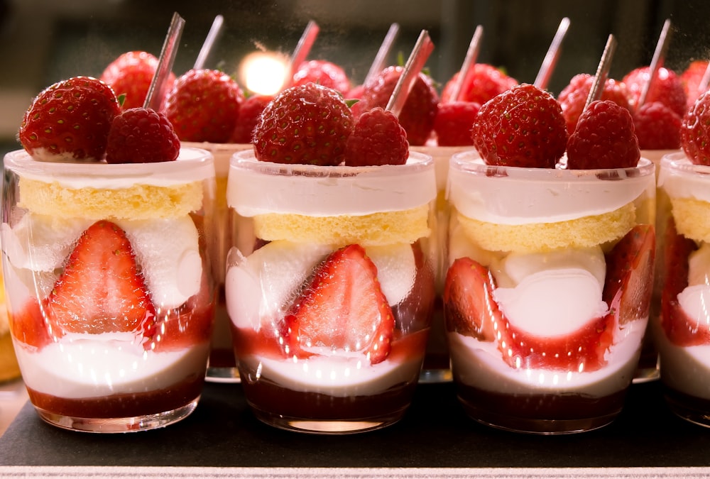 red strawberries inside clear drinking glass