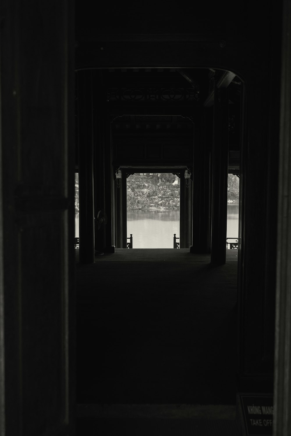 a black and white photo of a walkway