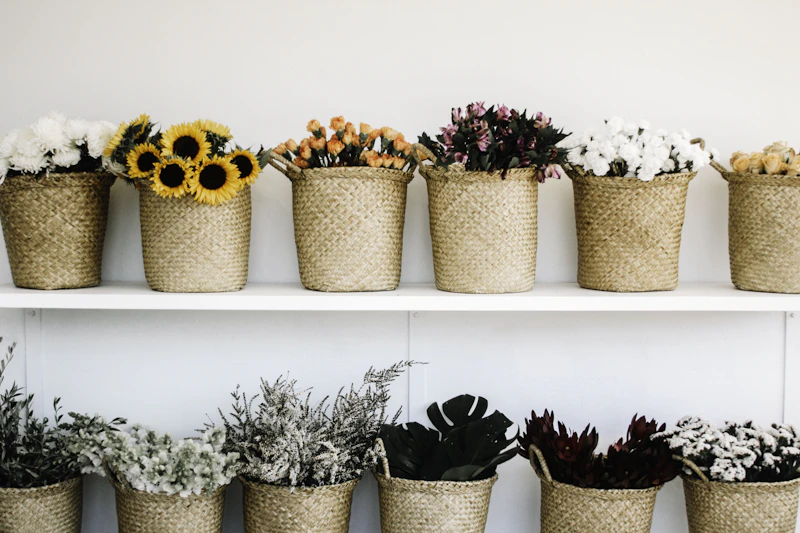 A bright everyday market bouquet wrapped in kraft paper on a worktable.