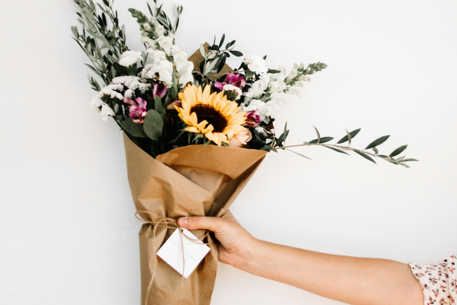 person holding bouquet of flowers