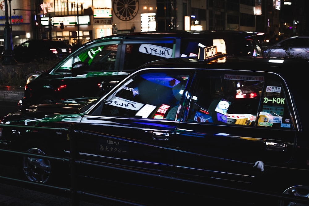 photography of black sedan at night