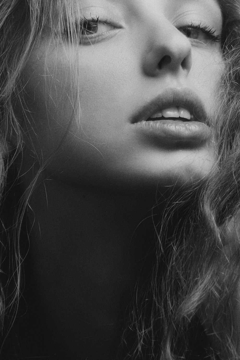 a black and white photo of a woman's face