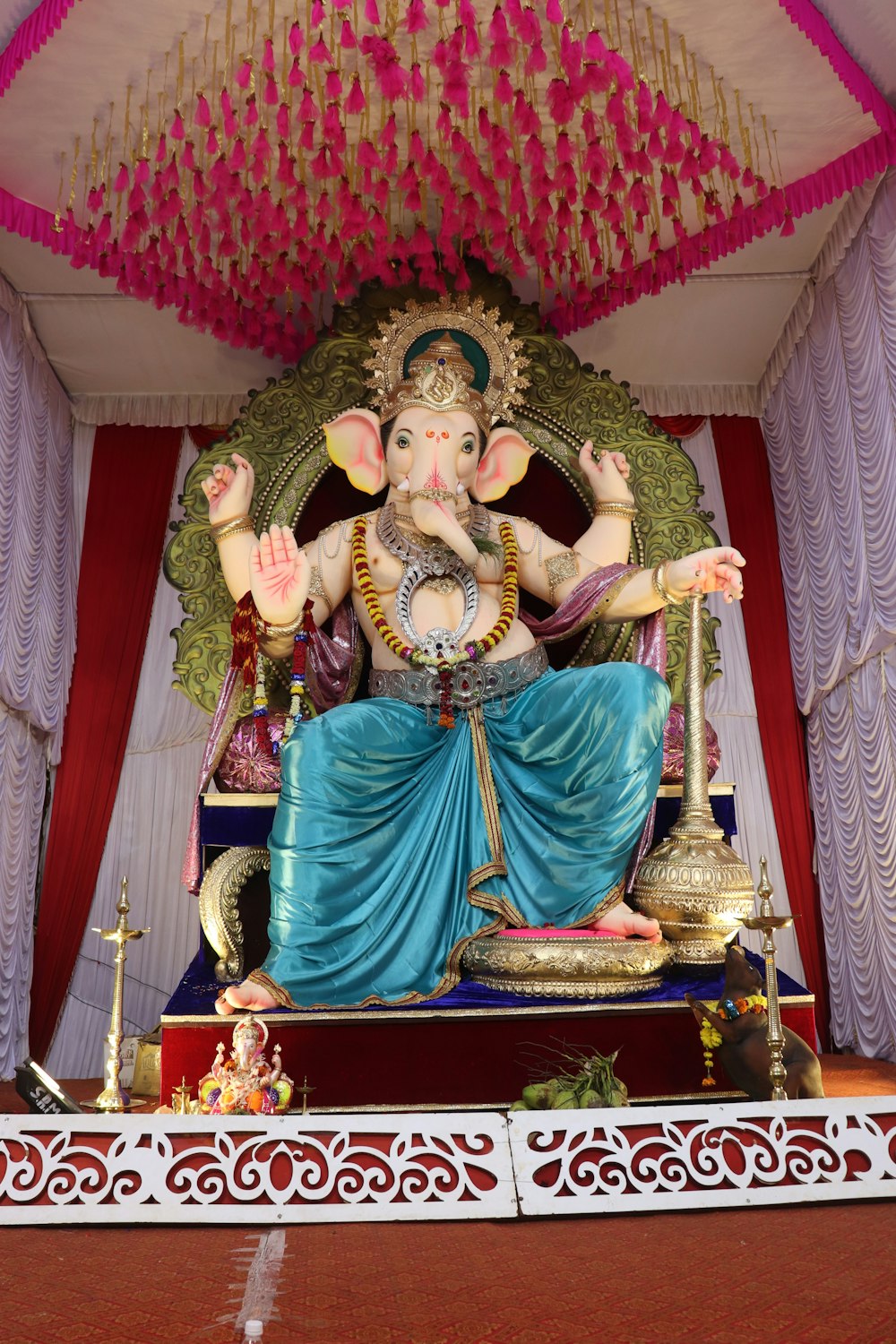 Lord Ganesha sitting statue on altar