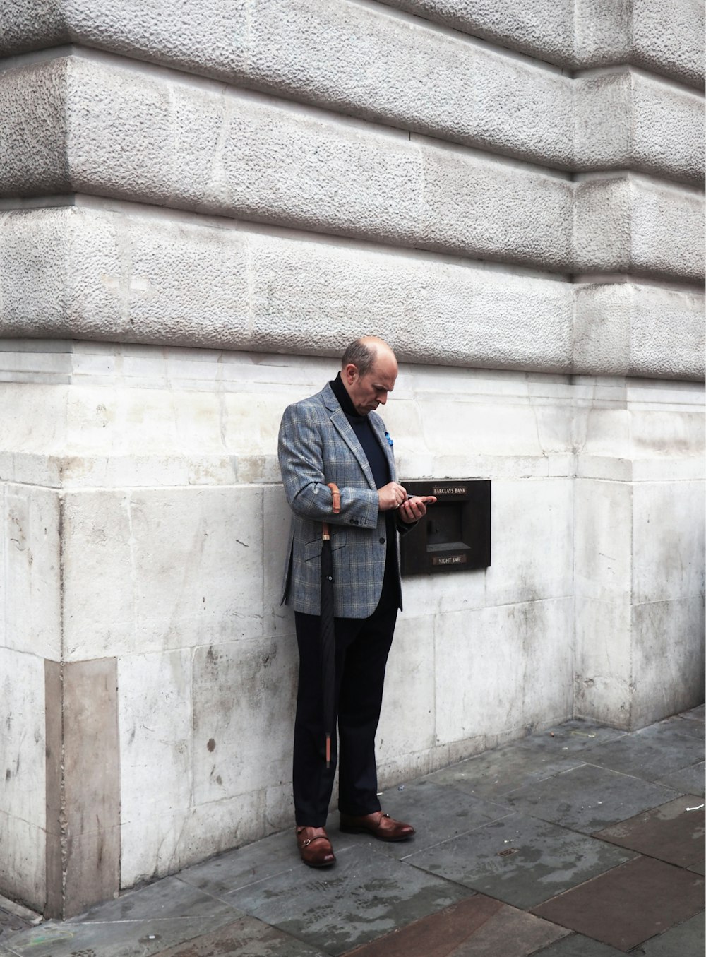 man near white wall