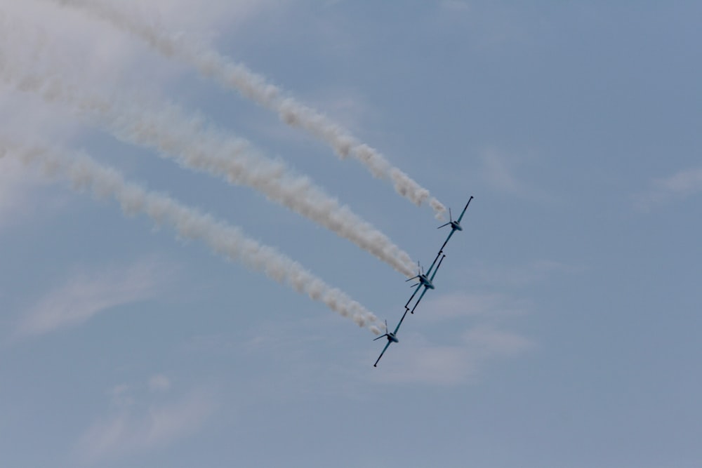 three flying planes at daytime