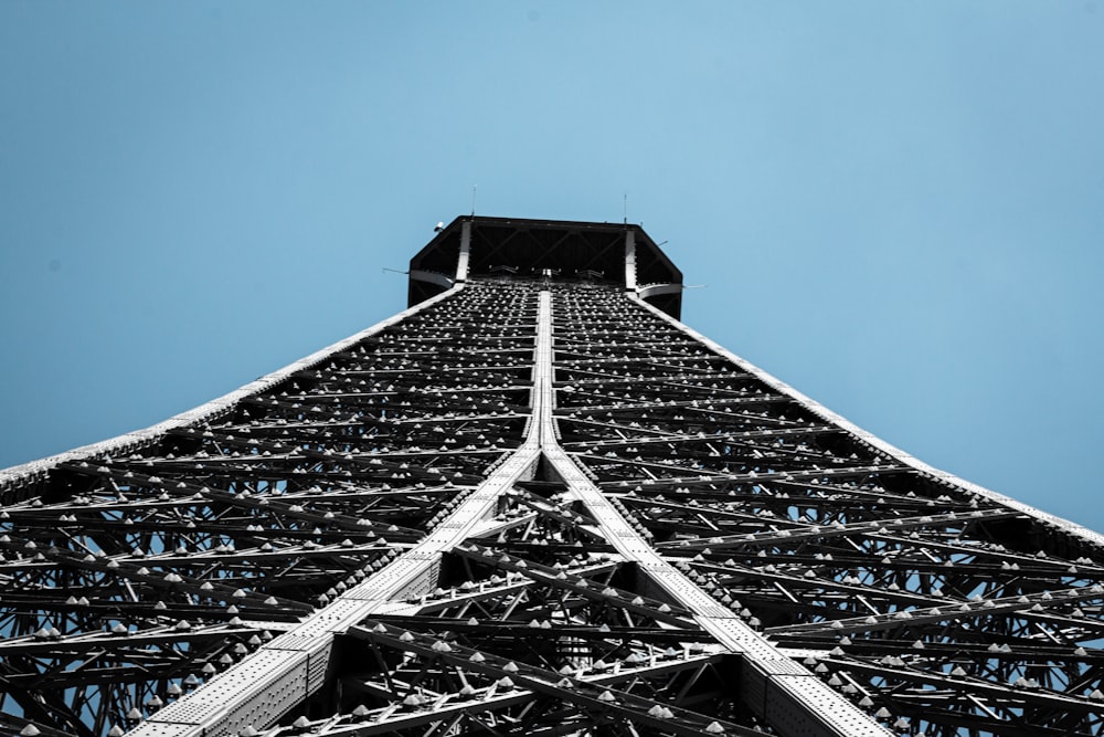 low-angle photography of gray tower under blue sky