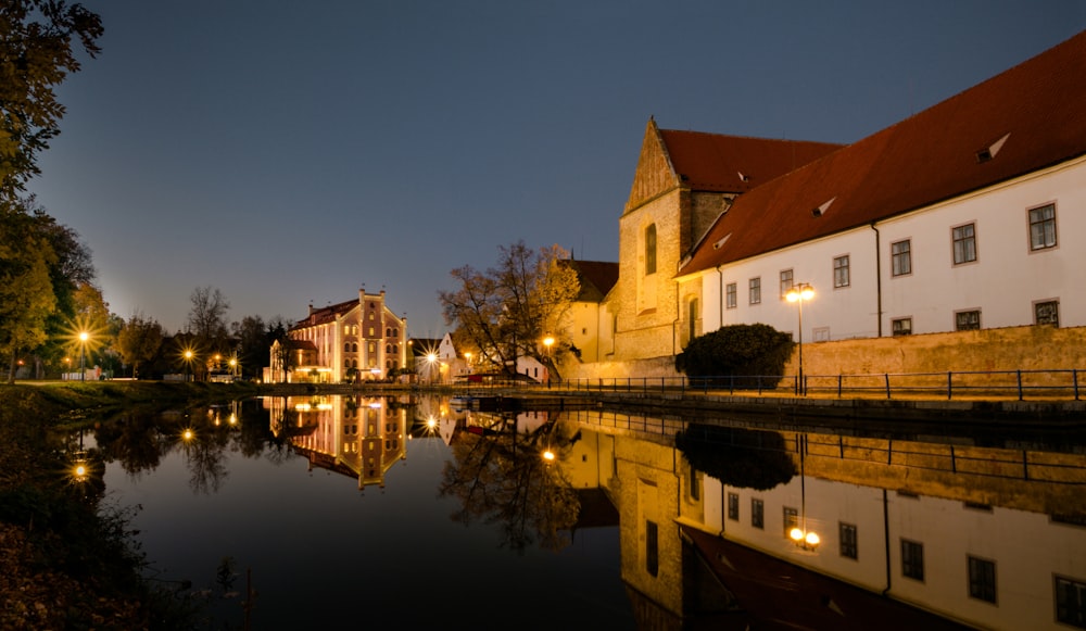 houses near lake during night time