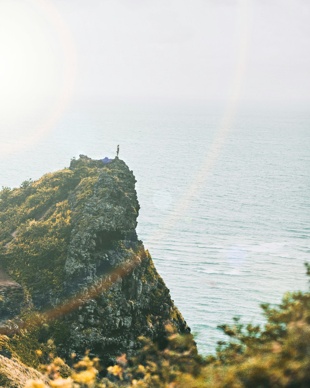 mountain near ocean during daytime