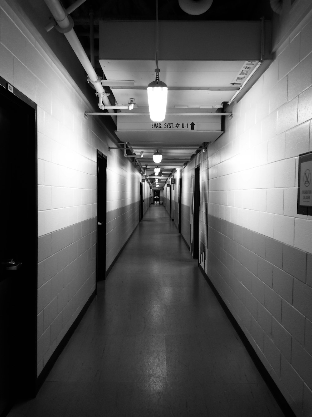 grayscale photography of empty hallway