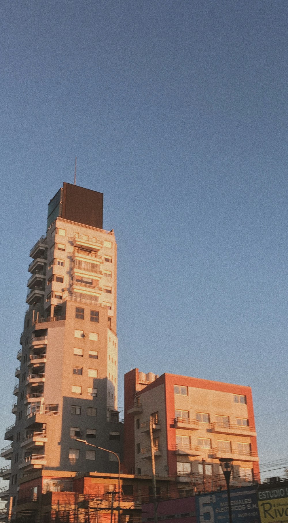 a tall building sitting next to a traffic light