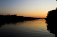 A sunset over a flowing river, symbolizing continuous learning and evolving leadership.