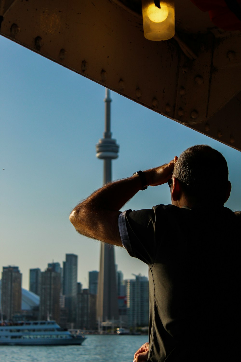man standing in front of CN tower