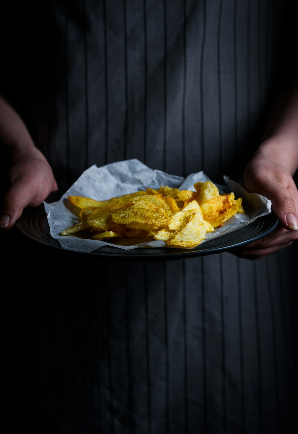 person holding platter