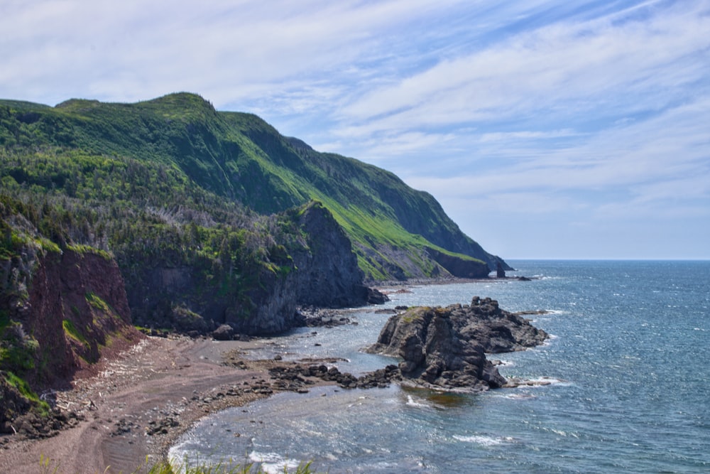 mountain ranges beside body of water