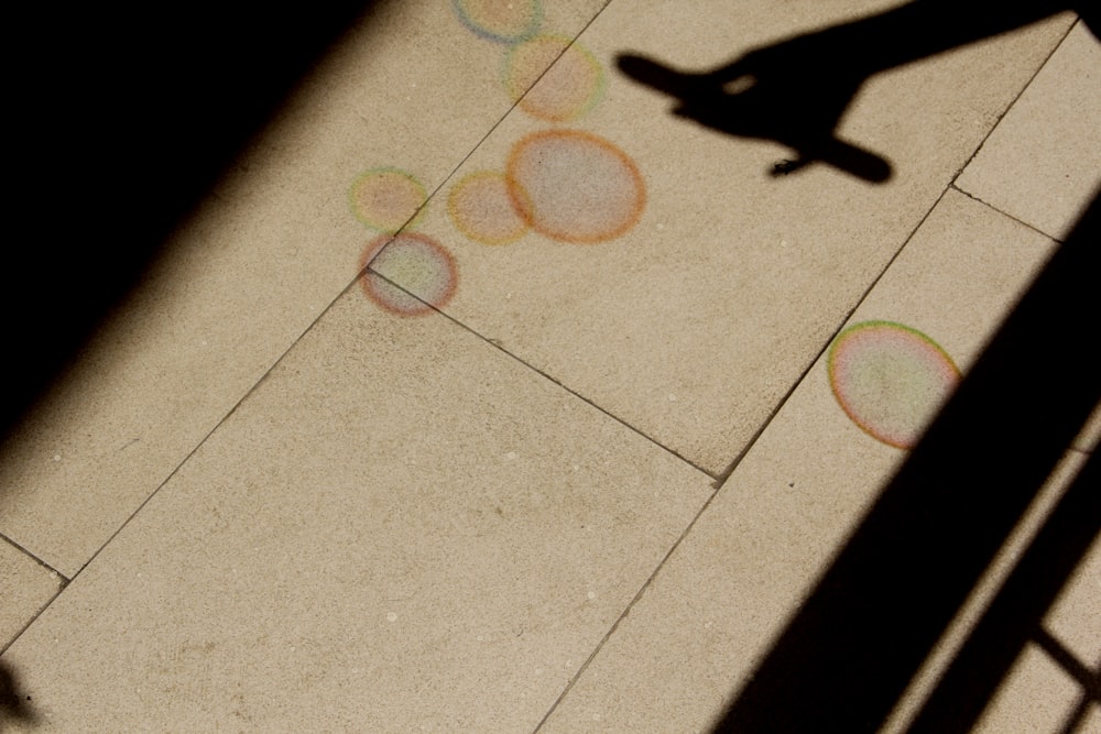 a shadow of a person on a skateboard