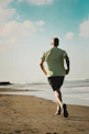man running on seashore