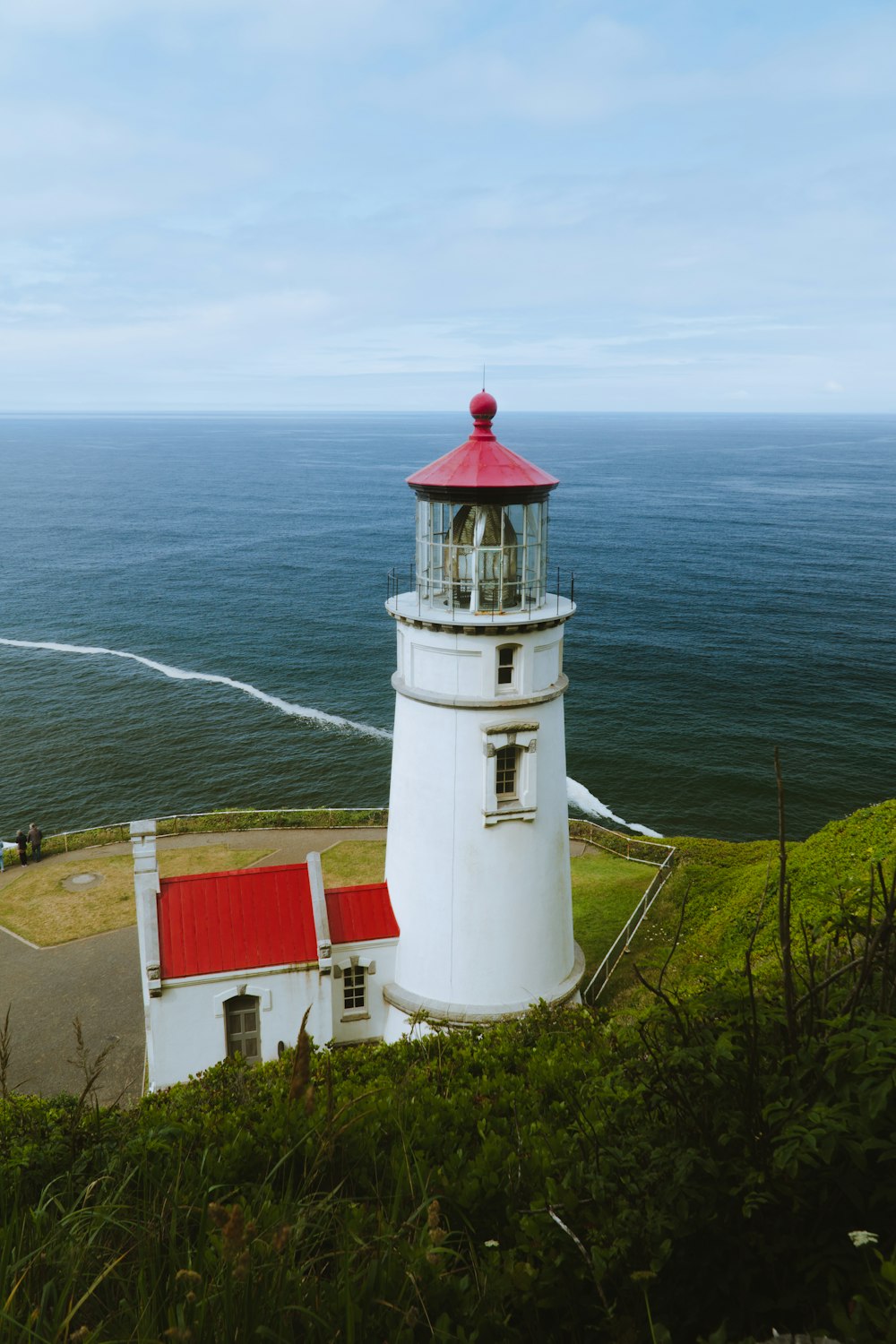 lighthouse on shore at daytime