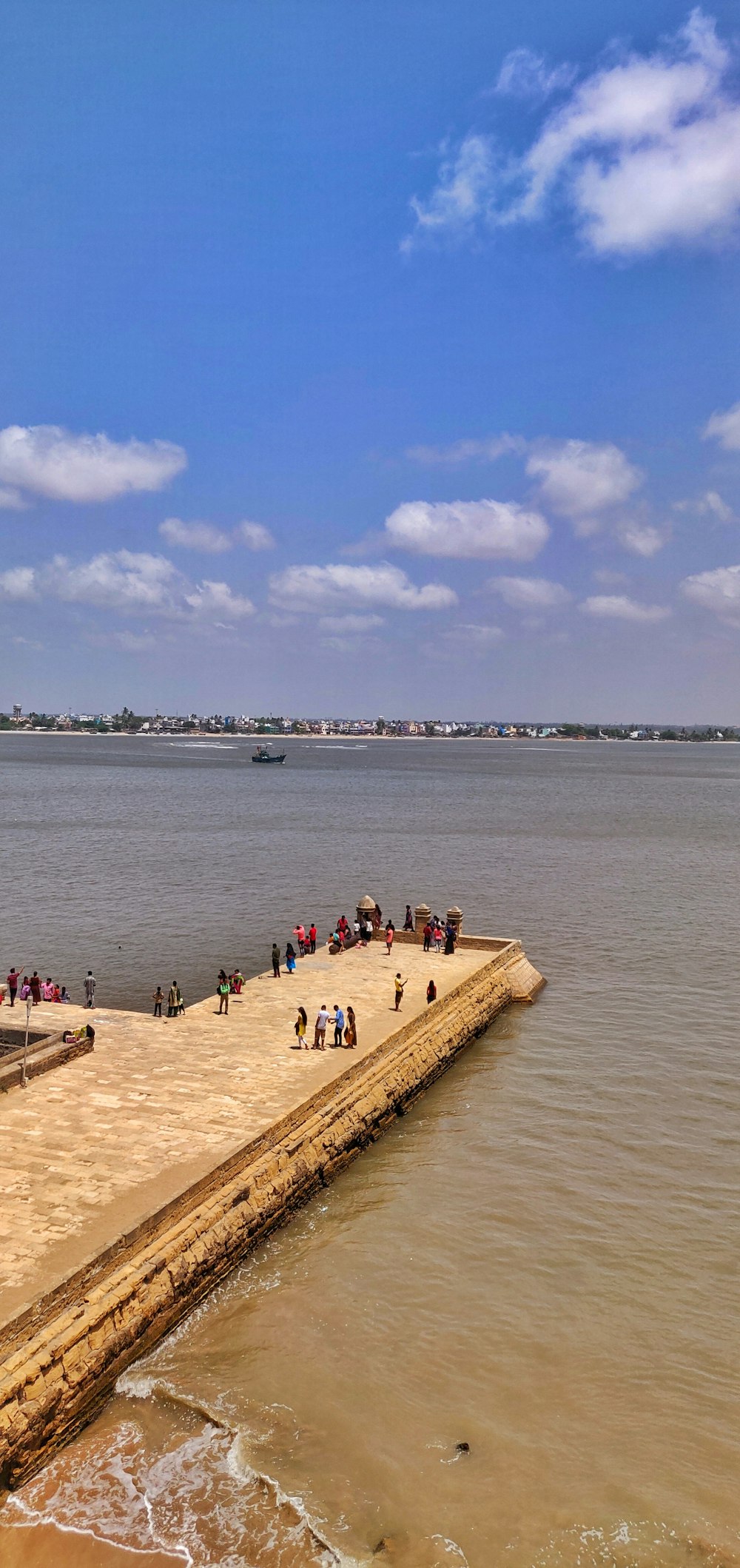 people standing on dock during daytime