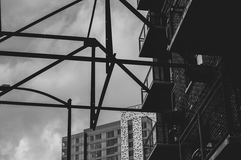 grayscale photo of gray and black scaffolding