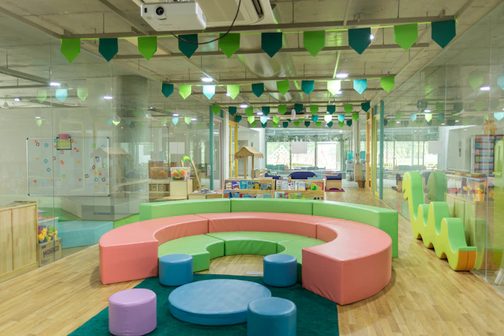 Bright and cheerful kids wearing colorful outfits, smiling and playing in a clean, modern setting with soft animated icons.