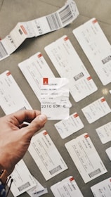 person holding white card