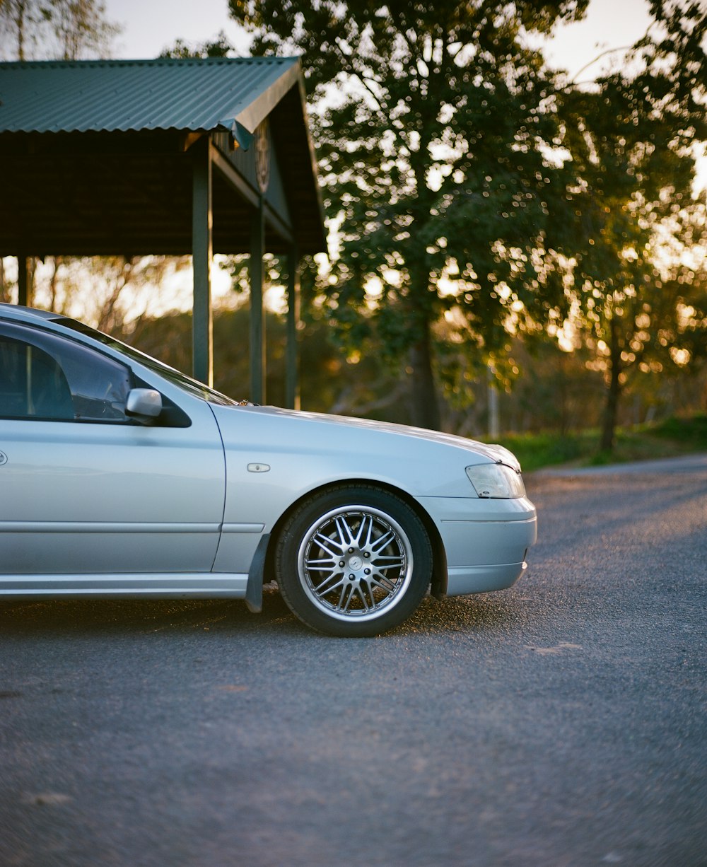 silver car beside a shed