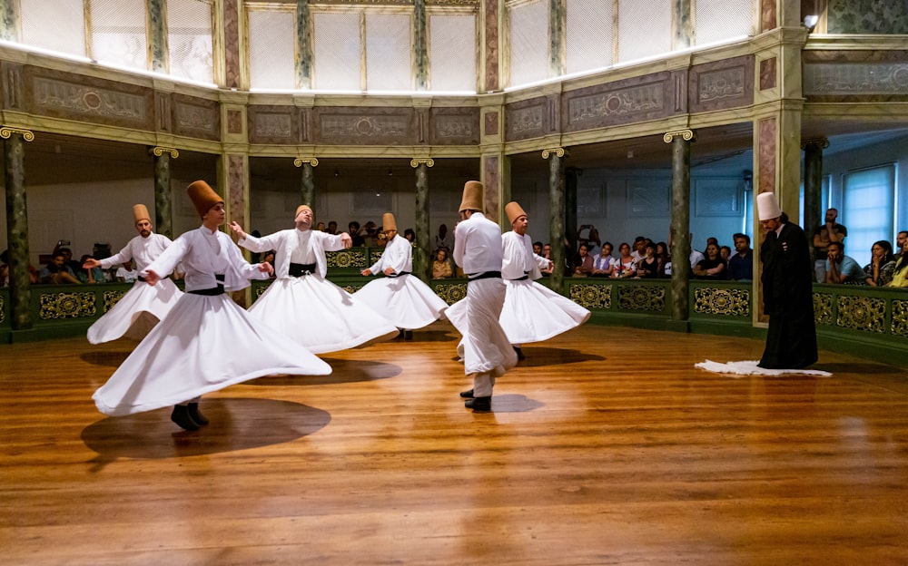 group of people dancing on stage