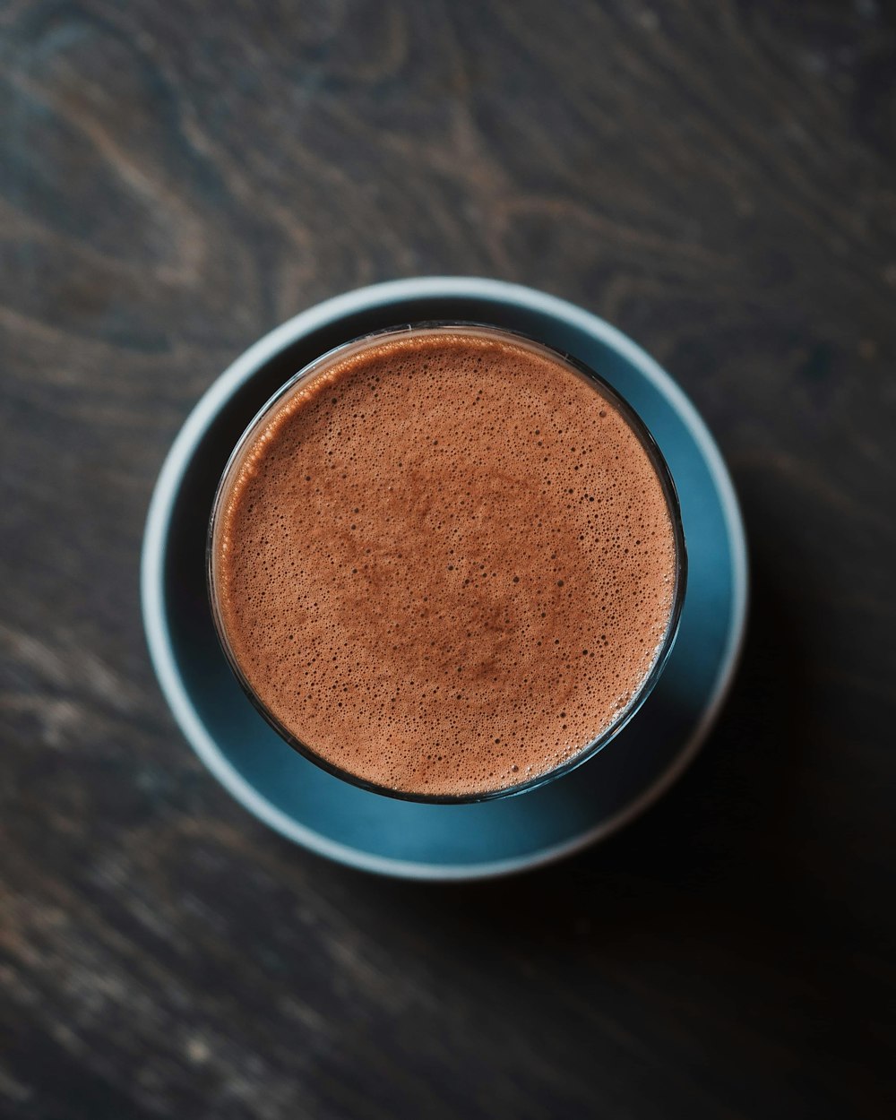 a cup of hot chocolate on a wooden table