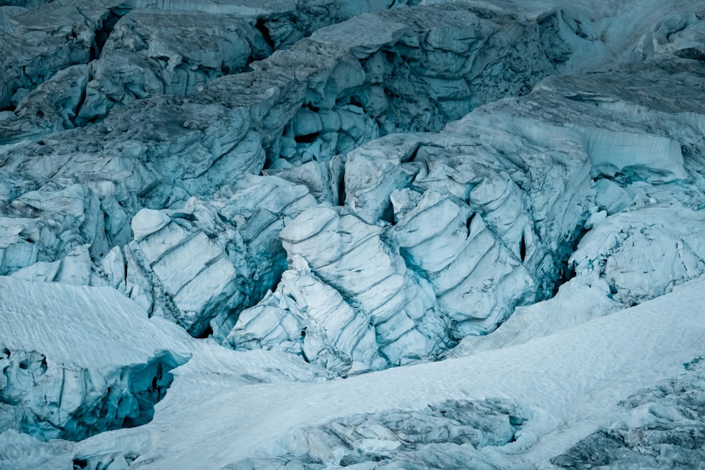 a large group of rocks covered in snow