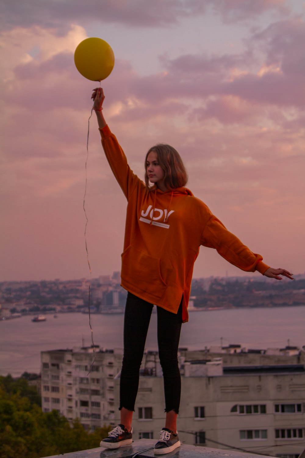 woman holding balloon