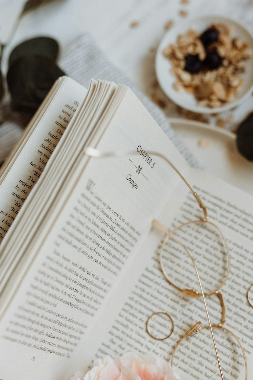 eyeglasses on opened book