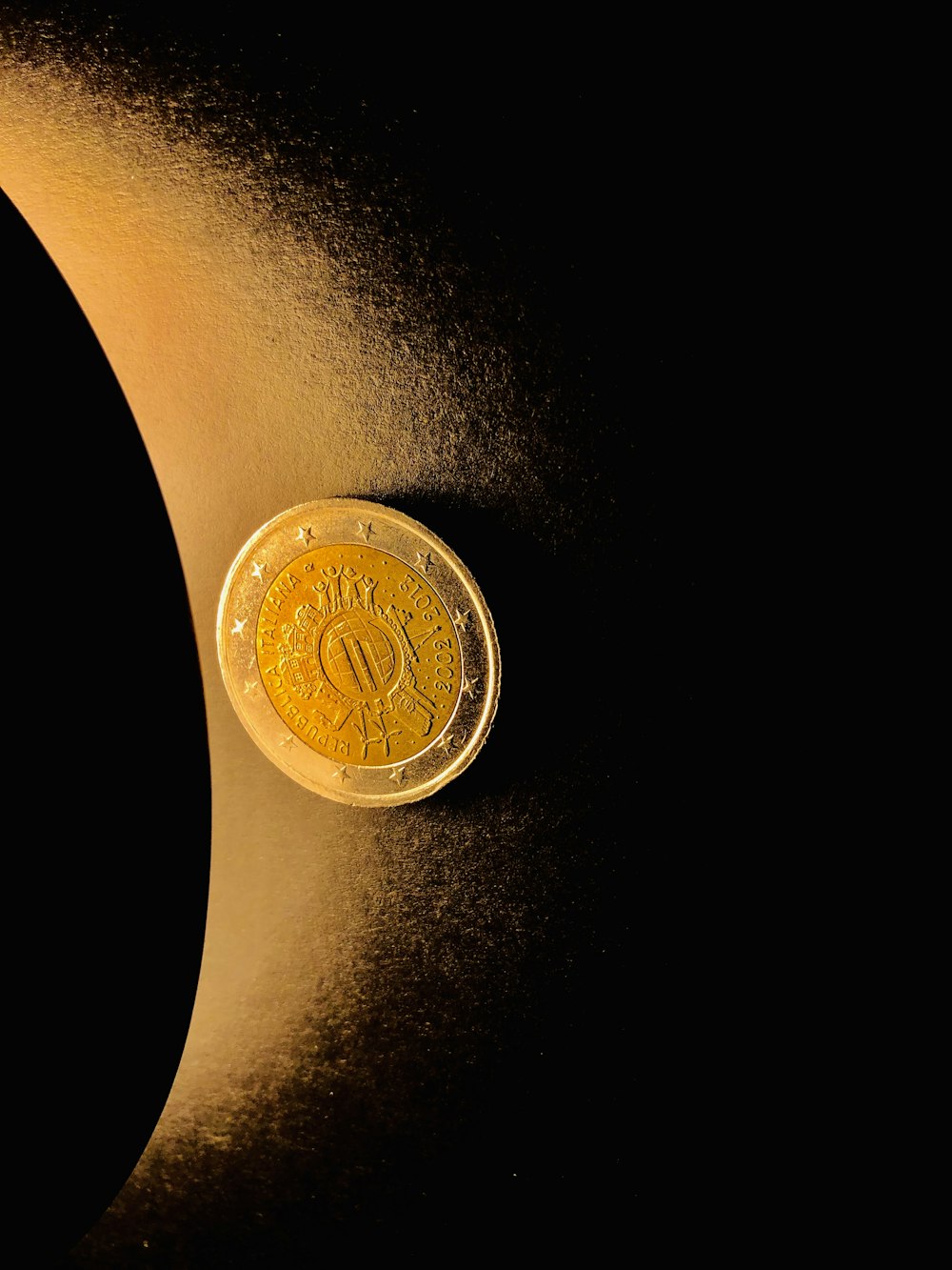 round gold-colored coin
