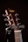 A close-up of a sturdy instrument stand holding a guitar.