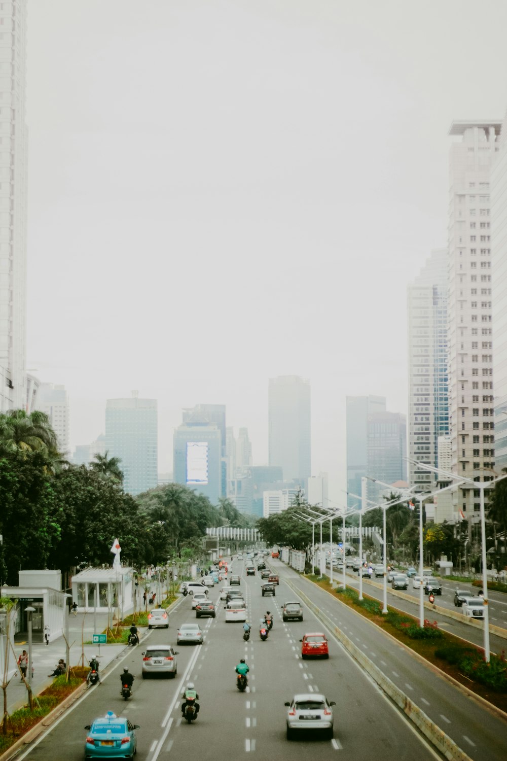 assorted-color vehicles under white sky