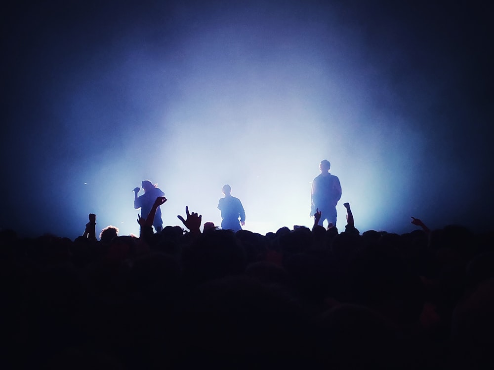 silhouette of band standing on stage